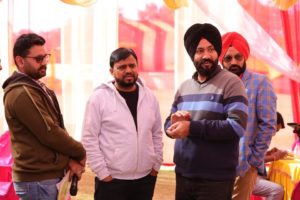 Avtar Singh Film Director with Karamjit Anmol in standing position